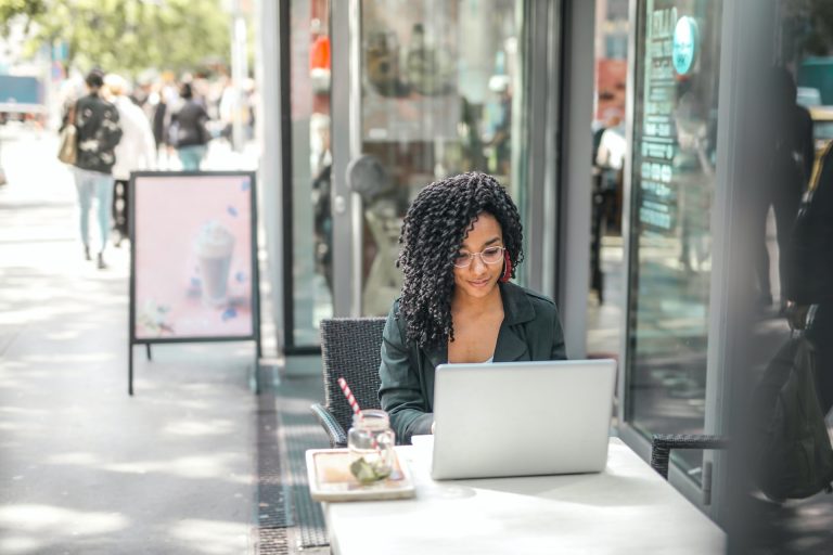 Young ethnic woman on computer-McKnight & McKnight Insurance