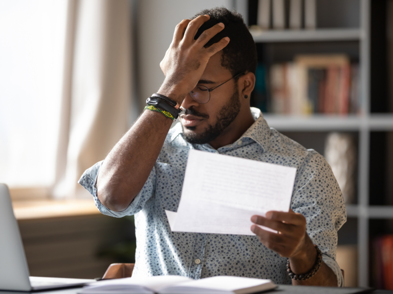 man with hand on forehead upset