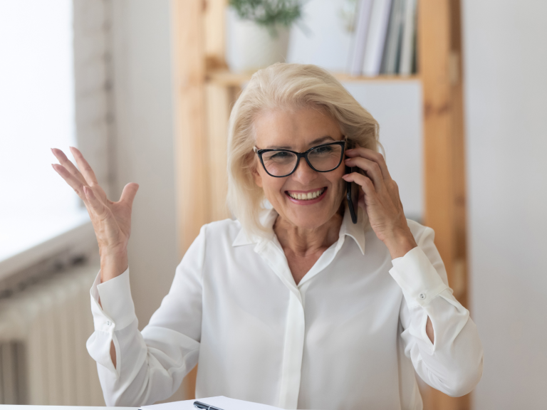 woman talking on the phone smiling